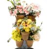 small plant stand with 6 pots displaying flowers.